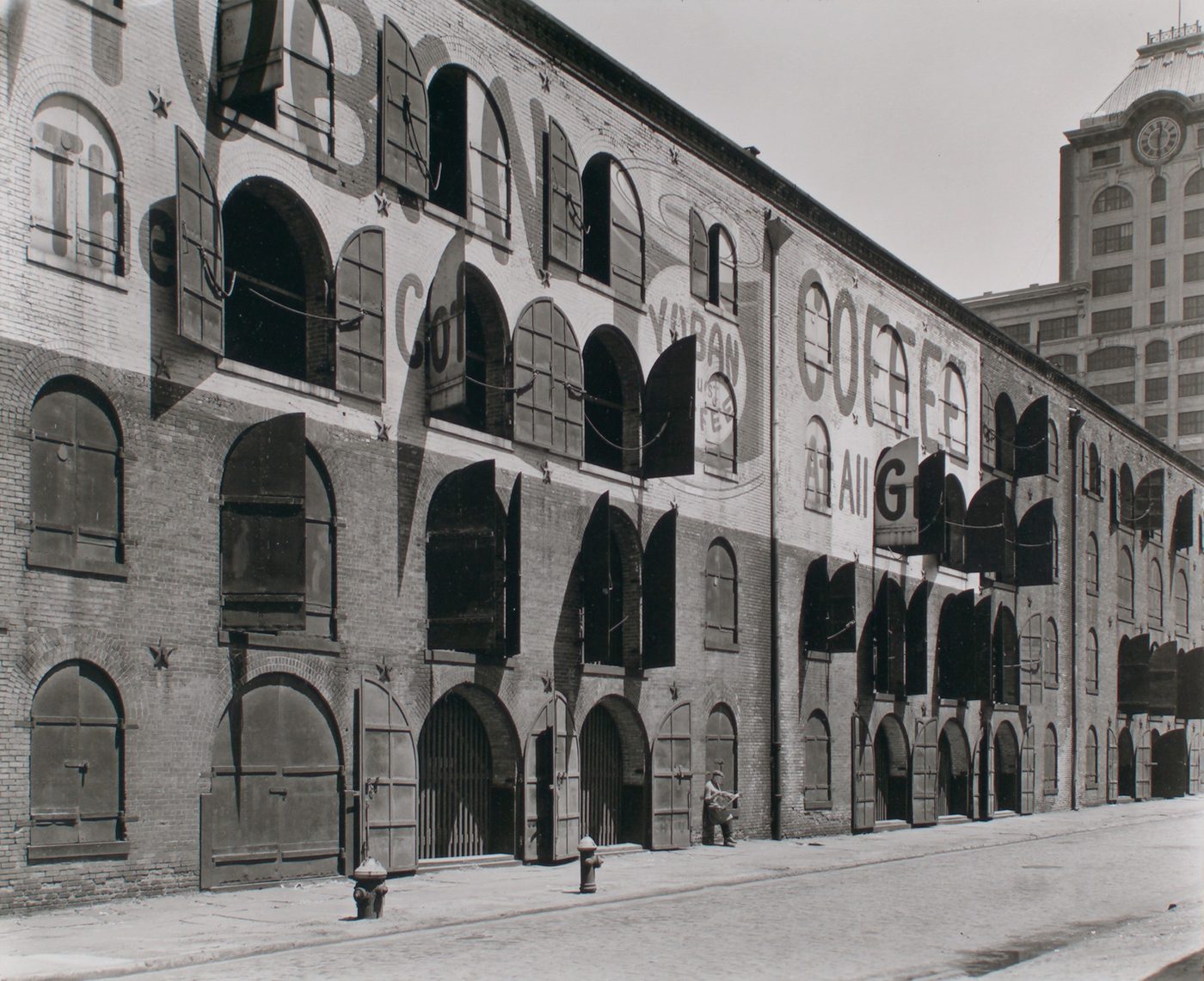 Rows of shuttered iron warehouse doors on Water and Dock Streets, Brooklyn, photographed in 1936